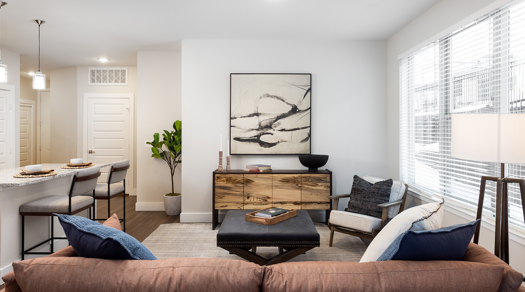 furnished living room with a coffee table and lounge chairs
