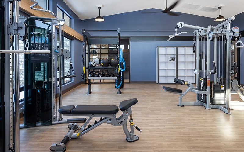 gym with wood floor and equipment